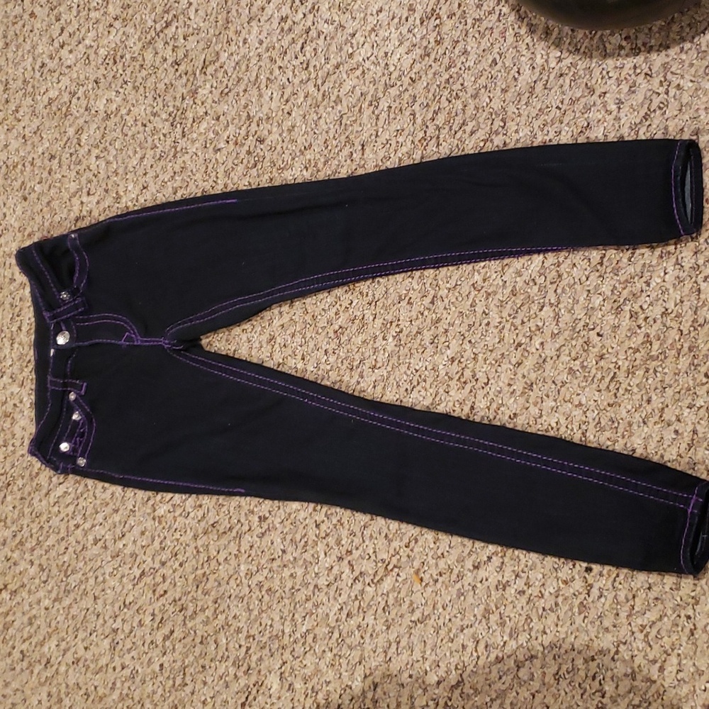 Women's True Religion Jeans..size 26..with purple trim